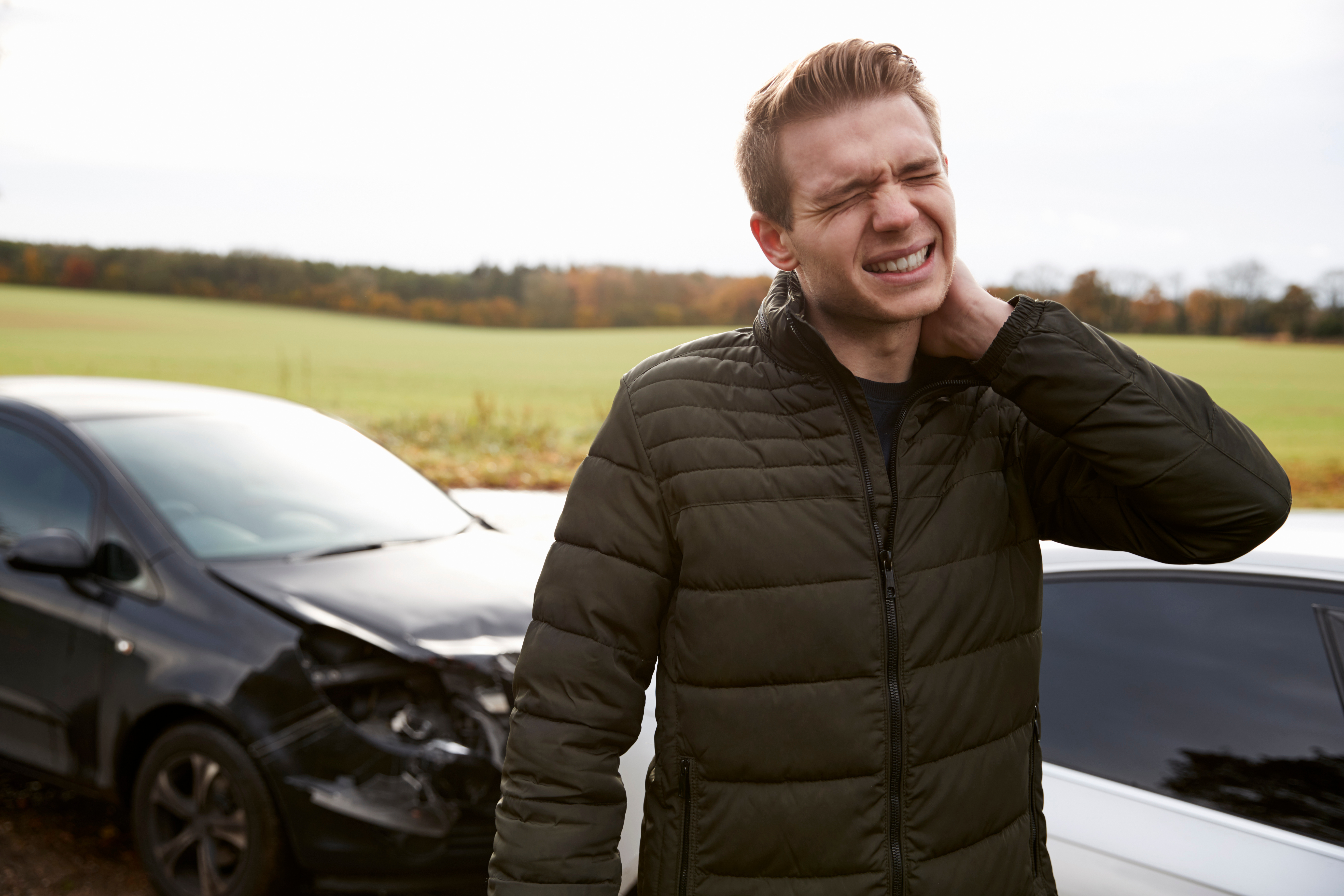 Man Suffering with Whiplash Injury after Car Accident
